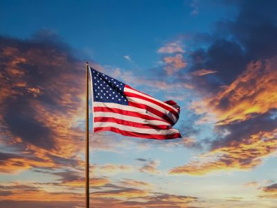 29975084_american-flag-on-old-flagpole-at-sunset